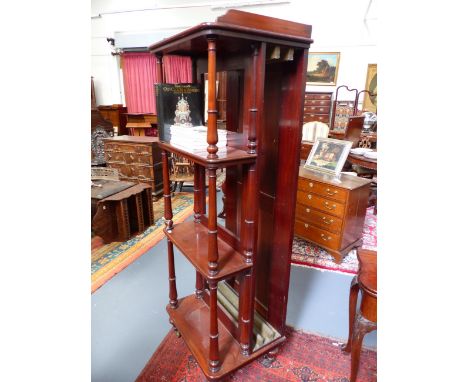 A VICTORIAN MAHOGANY FOUR TIER WHAT NOT/LEAF HOLDER CABINET ON RING TURNED SUPPORTS WITH BRASS CASTORS.   H.181 x W.60 x D.48