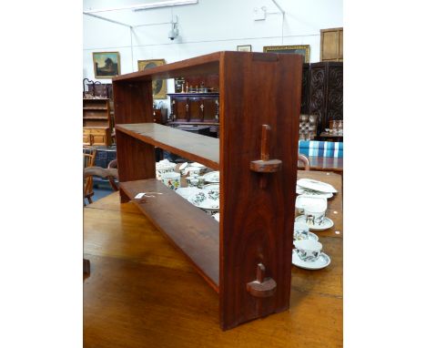 A TEAK COTSWOLD SCHOOL TWO SHELF LOW BOOKCASE.   H.70 x W.138cms.