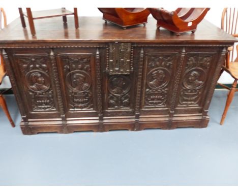 AN EARLY 17th.C.AND LATER LARGE OAK COFFER WITH CARVED PORTRAIT AND FOLIATE PANEL FRONT.   W.170 x H.84cms.
