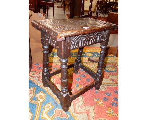 A 17th.C.AND LATER OAK JOINT STOOL WITH CARVED DECORATION.   W.45cms