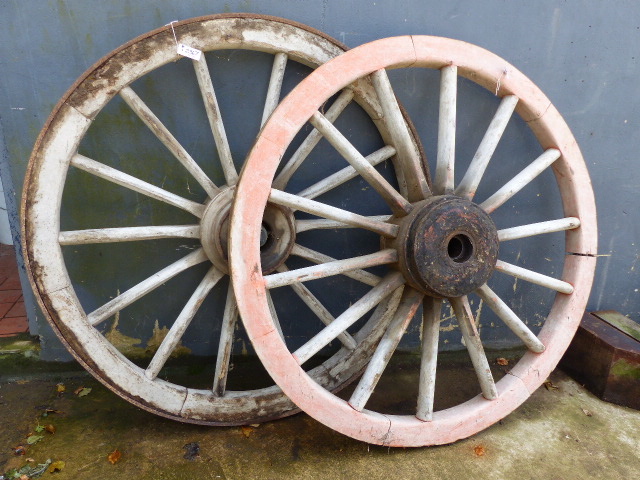 TWO LARGE ANTIQUE WAGON WHEELS. D.140cms.