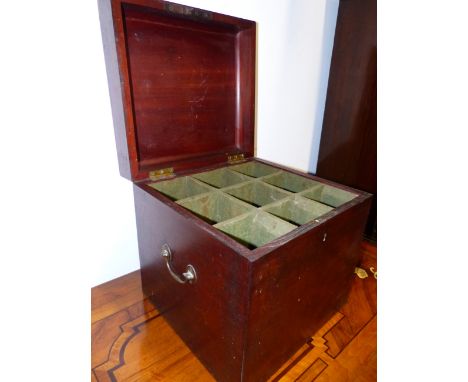 A REGENCY MAHOGANY LIFT TOP DECANTER BOX, THE INTERIOR DIVIDED TO HOLD NINE BOTTLES, WITH BRASS CARRYING HANDLES.   W.39cms