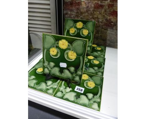 EIGHT ART NOUVEAU FLORAL DESIGN POTTERY TILES.