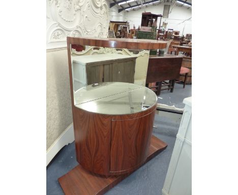 AN UNUSUAL ROSEWOOD MIRROR BACK SIDE CABINET OF BOWED FORM IN THE ART DECO TASTE.   H.106 x W.106 x D.36cms.