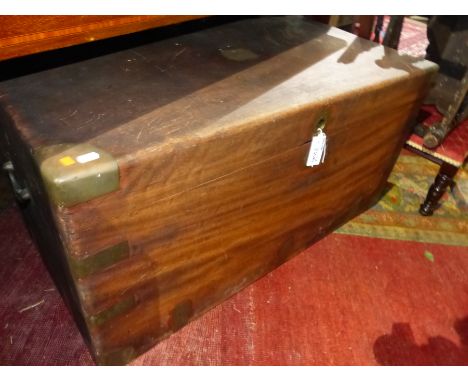 AN ANTIQUE BRASS BOUND CAMPHOR WOOD CAMPAIGN TRAVELLING TRUNK. BRASS CARRYING HANDLES. W.106cm.