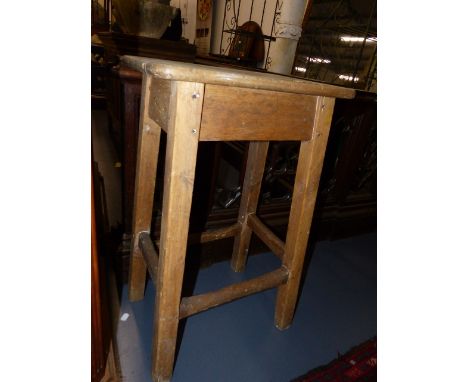 AN ANTIQUE RUSTIC PINE AND SYCAMORE STOOL.