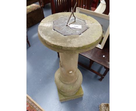 AN EARLY CARVED STONE SUNDIAL PLINTH WITH ASSOCIATED ENGRAVED BRASS SUNDIAL WITH INSCRIPTION SINE UMBRA NIHIL.