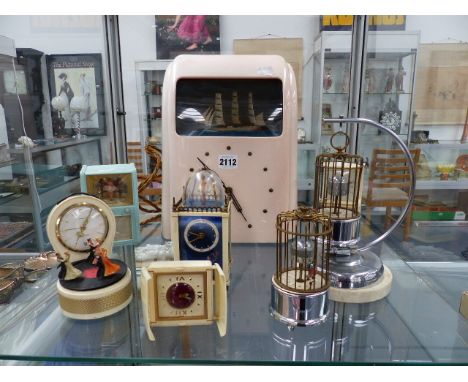 A RARE BAKELITE CLOCK AUTOMATON TOGETHER WITH VARIOUS NOVELTY CLOCKS,ETC