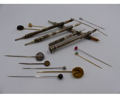 FIVE PROPELLING WRITING INSTRUMENTS TOGETHER WITH A QUANTITY OF VARIOUS STICK PINS.  