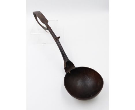 AN UNUSUAL ANTIQUE CARVED SERVING SPOON/LADLE WITH SCROLLED HANDLE DECORATED WITH A BIRD AND INITIALS.   L.38cms.