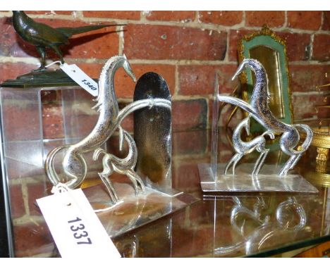 A PAIR OF ART DECO CHROMED EQUESTRIAN BOOK ENDS.DESIGNED BY FRANZ HAGENAUR H.14cms.