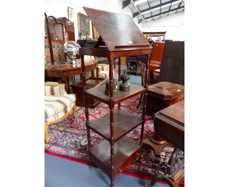 A MAHOGANY ADJUSTABLE FOUR TIER WHAT NOT STAND WITH RING TURNED SUPPORTS AND BASE DRAWER ON BRASS CASTORS.