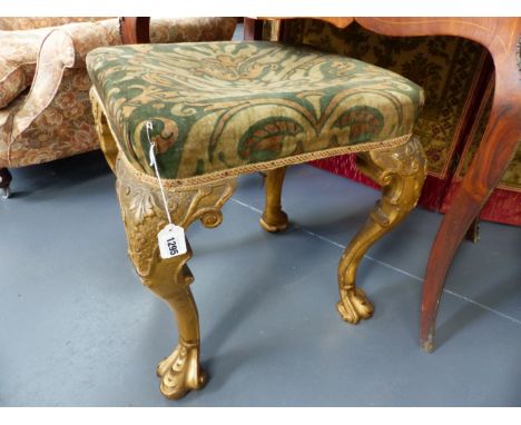 A CARVED GILTWOOD STOOL IN THE EARLY 18th.C.STYLE.