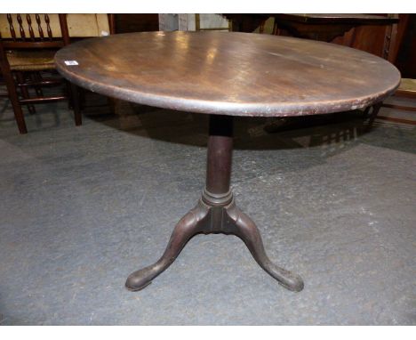 A GEO.III. MAHOGANY TRIPOD TABLE WITH SINGLE PIECE TOP OVER GUN BARREL COLUMN AND STOUT CARVED LEGS WITH PAD FEET.   D.84cms.