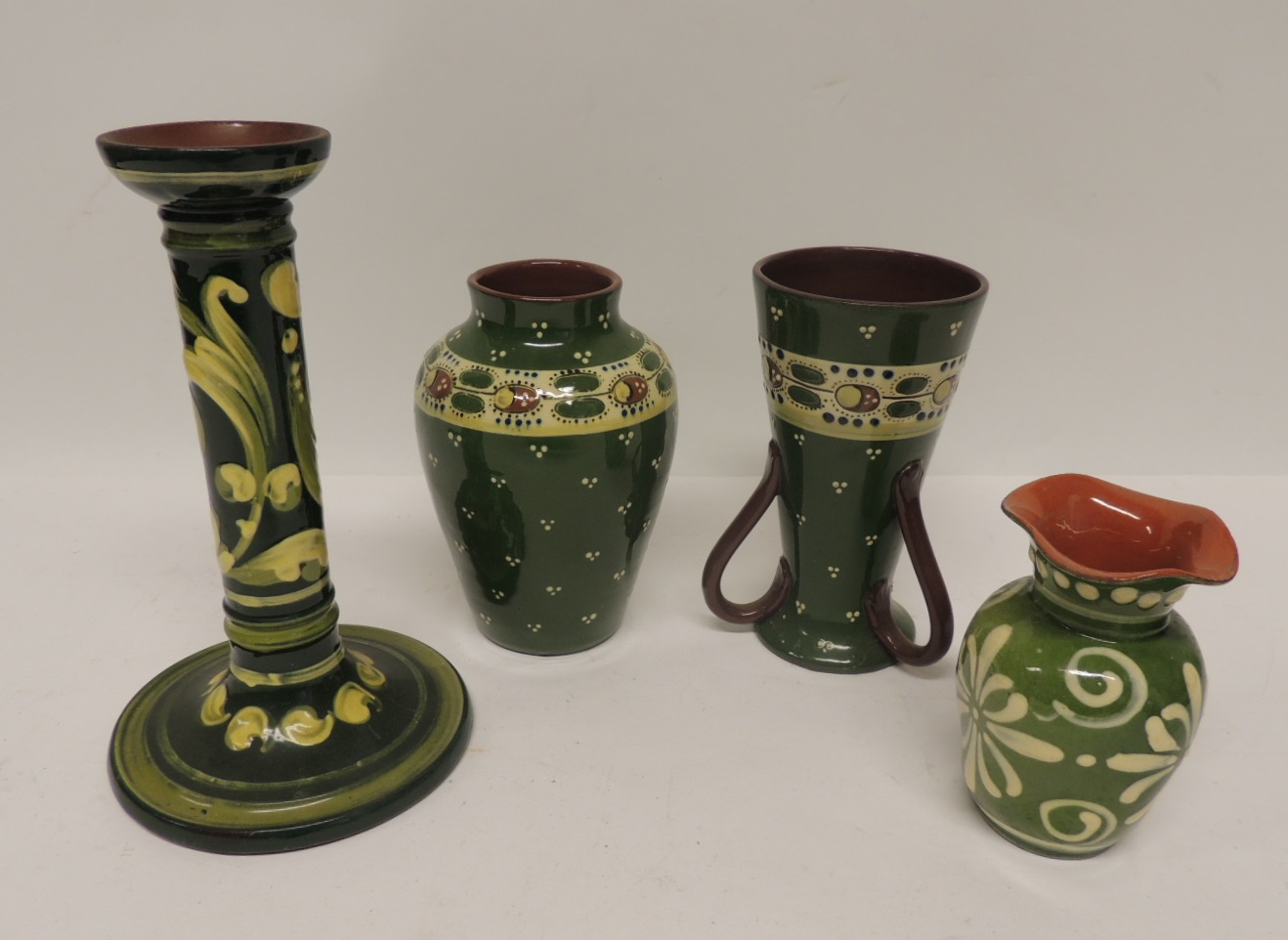 Aller Vale pottery candlestick, 21cms high, three handled vase and two