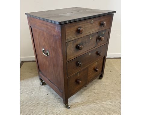 A 19th Century mahogany campaign commode/washstand, the plain top with ebony reeded edging opening to reveal a now vacant int