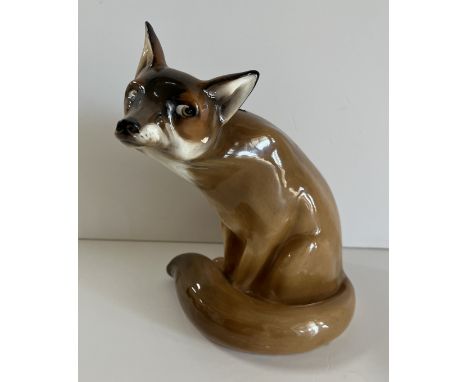 A Royal Doulton figure of a seated fox (HN 130), 22.5 cm high CONDITION REPORTS The fox's left hand ear has been broken and r