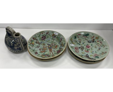 A collection of four Chinese celadon glazed plates with polychrome enamel decoration of butterflies and insects amongst flowe