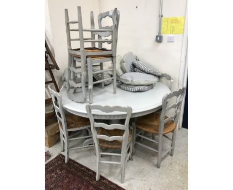 A painted wooden breakfast table of circular form raised on pedestal base 140 cm diameter x 78.5 cm high together with a set 