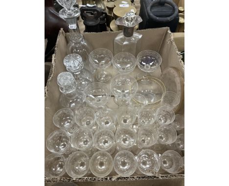 An elongated hexagonal cut glass decanter with silver fitting, a large 19th Century mallet-shaped decanter and stopper, a pai