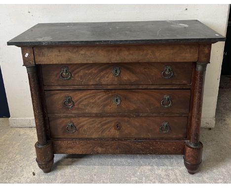 A Louis Philippe mahogany commode, the black marble top over a plain drawer and three further recessed figured drawers with o