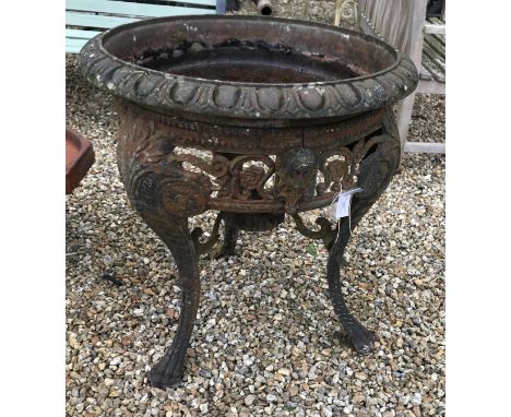 A wrought iron table base with a wrought iron planter set in the top, 70 cm high x 70 cm wide