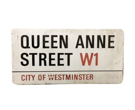 An enamelled steel street sign for Queen Anne Street W1, City of Westminster with iconic black and red sans serif lettering f