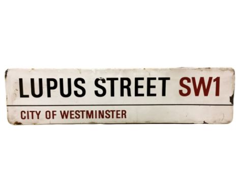 An enamelled steel street sign for Lupus Street SW1, City of Westminster with iconic black and red sans serif lettering first