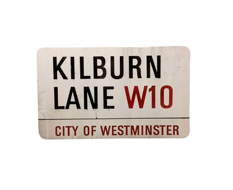 An enamelled steel street sign for Kilburn Lane W10, City of Westminster with iconic black and red sans serif lettering first