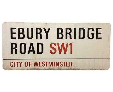 An enamelled steel street sign for Ebury Bridge Road SW1, City of Westminster with iconic black and red sans serif lettering 