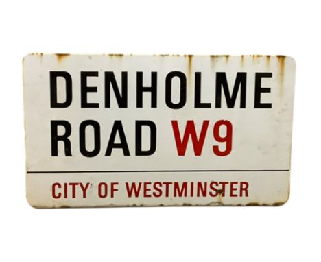 An enamelled steel street sign for Denholme Road W9, City of Westminster with iconic black and red sans serif lettering first