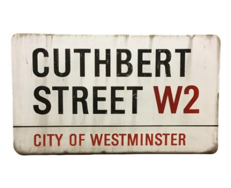 An enamelled steel street sign for Cuthbert Street W2, City of Westminster with iconic black and red sans serif lettering fir