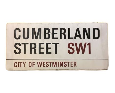 An enamelled steel street sign for Cumberland Street SW1, City of Westminster with iconic black and red sans serif lettering 