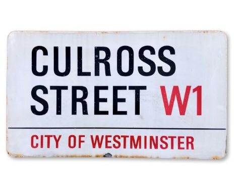 An enamelled steel street sign for Culross Street W1, City of Westminster, with iconic and black and red sans serif lettering