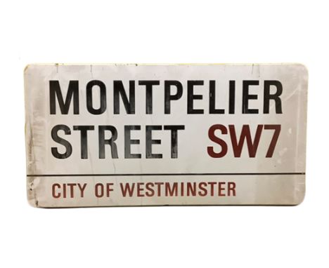An enamelled steel street sign for Montpelier Street SW7,  City of Westminster with iconic black and red sans serif lettering