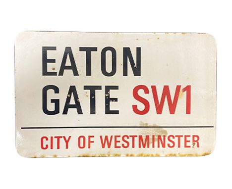 An enamelled steel street sign for Eaton Gate SW1  City of Westminster with iconic black and red sans serif lettering first c