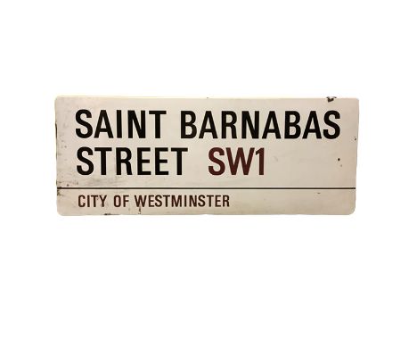 An enamelled steel street sign for Saint Barnabas Street SW1, City of Westminster with iconic black and red sans serif letter
