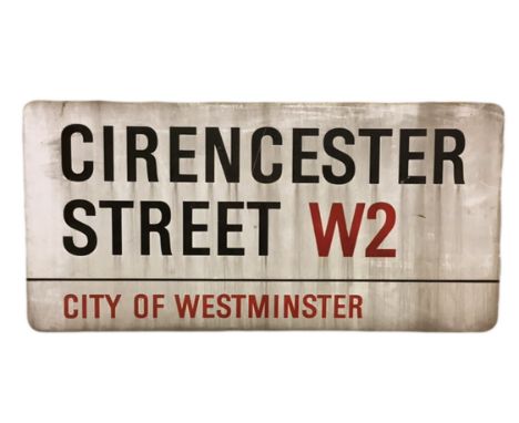 An enamelled steel street sign for Cirencester Street W2, City of Westminster with iconic black and red sans serif lettering 