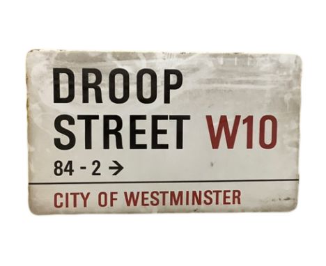 An enamelled steel street sign for Droop Street W10 signed 84-2, City of Westminster with iconic black and red sans serif let