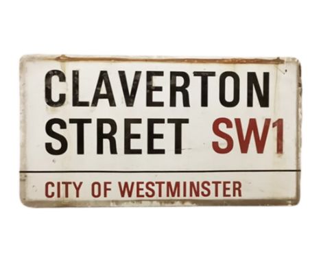 An enamelled steel street sign for Claverton Street SW1, City of Westminster with iconic black and red sans serif lettering f