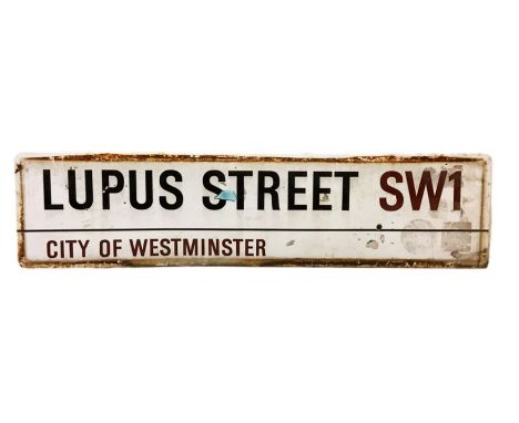 An enamelled steel street sign for Lupus Street SW1,  City of Westminster with iconic black and red sans serif lettering firs
