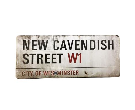 An enamelled steel street sign for New Cavendish Street W1, City of Westminster with iconic black and red sans serif letterin
