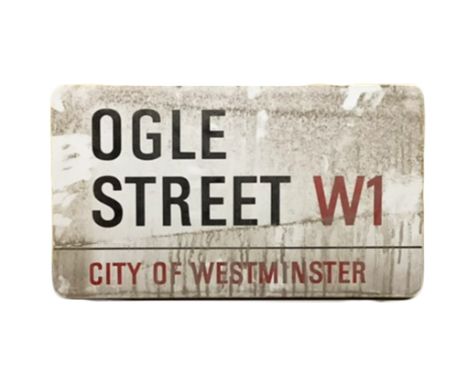 An enamelled steel street sign for Ogle Street W1 City of Westminster with iconic black and red sans serif lettering first cr