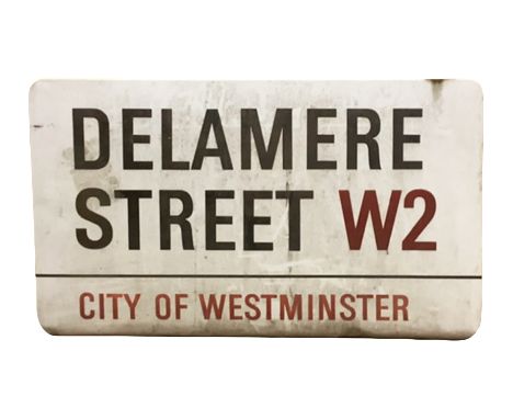 An enamelled steel street sign for Delamere Street W2, City of Westminster with iconic black and red sans serif lettering fir