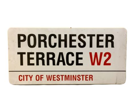 An enamelled steel street sign for Porchester Terrace W2, City of Westminster with iconic black and red sans serif lettering 