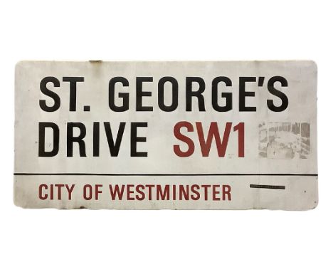 An enamelled steel street sign for St. George's Drive SW1, City of Westminster with iconic black and red sans serif lettering