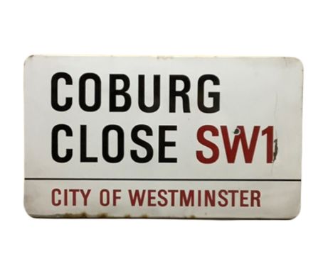 An enamelled steel street sign for Coburg Close SW1, City of Westminster with iconic black and red sans serif lettering first