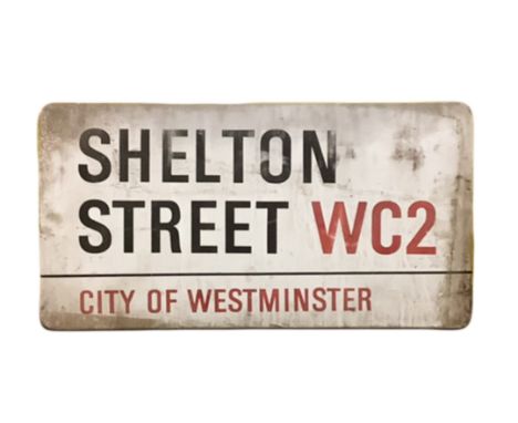 An enamelled steel street sign for Shelton Street WC2, City of Westminster with iconic black and red sans serif lettering fir