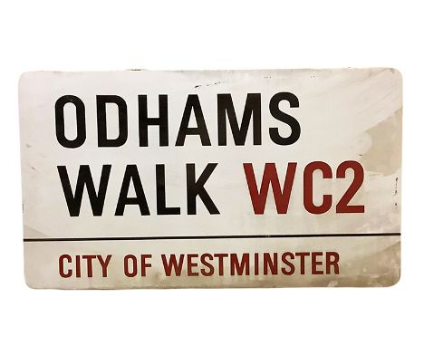 An enamelled steel street sign for Odhams Walk WC2, City of Westminster with iconic black and red sans serif lettering first 