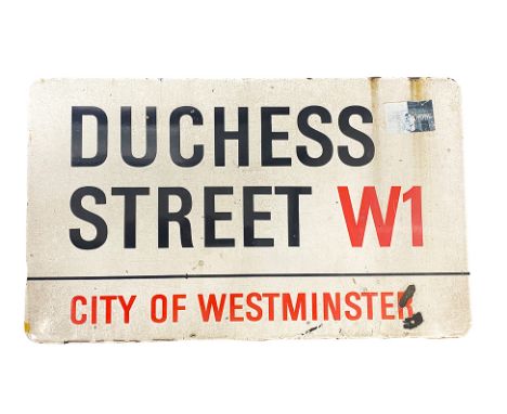 An enamelled steel street sign for Duchess Street W1 City of Westminster with iconic black and red sans serif lettering first
